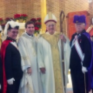 On December 30, members of St. Matthew Norwalk Knights of Columbus Council 14360, representing Assembly #100, Bishop Fenwick in Norwalk, attended Mass at Our Lady of Solace church in the Coney Island section of Brooklyn. The assembly members dressed in full color guard regalia and were led by Color Corps Commander Bill Berger, Faithful Navigator of Assembly #100. The Mass was celebrated by the Bishop of Brooklyn, Bishop Nicholas DeMarzio. Our Lady of Solace Parish was hit hard by Hurricane Sandy, and through St. Matthew’ Parish in Norwalk, the Knights have helped out with goods, Christmas gifts and other supplies to get parishioners through the holidays. In the picture with Bishop DeMarzio are Sir Knights Anthony Armentano, Scott Mazzo, Mike Colaluca, Bill Berger, George Ribellino and Scott Criscuolo.